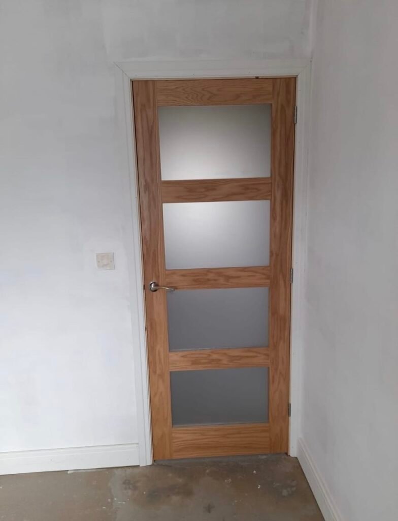 New glazed oak internal door fitted in a Birmingham garage conversion