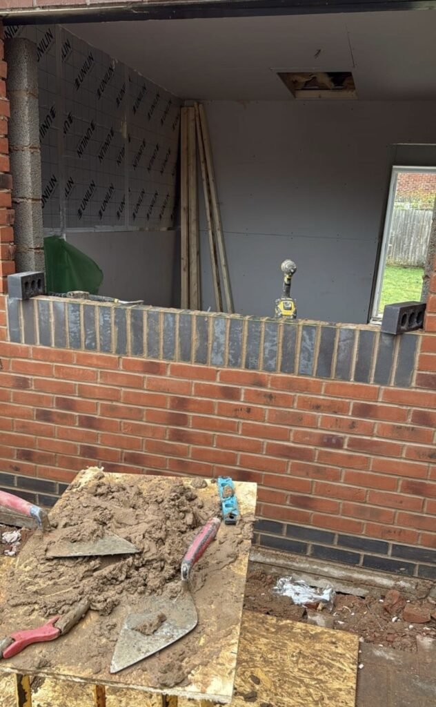 Bricking up the garage door opening during a West Midlands garage conversion